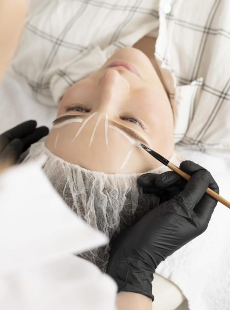 woman-getting-eyebrow-treatment
